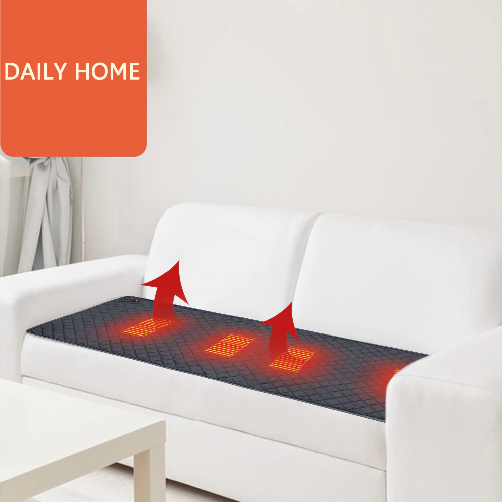 A white couch with a heating blanket to keep warm in freezing winter