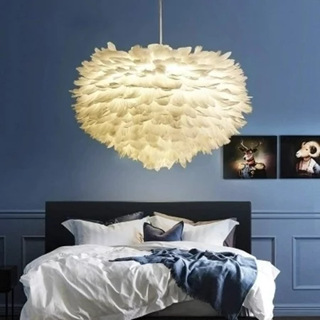 Blue walls, white feather pendant light.